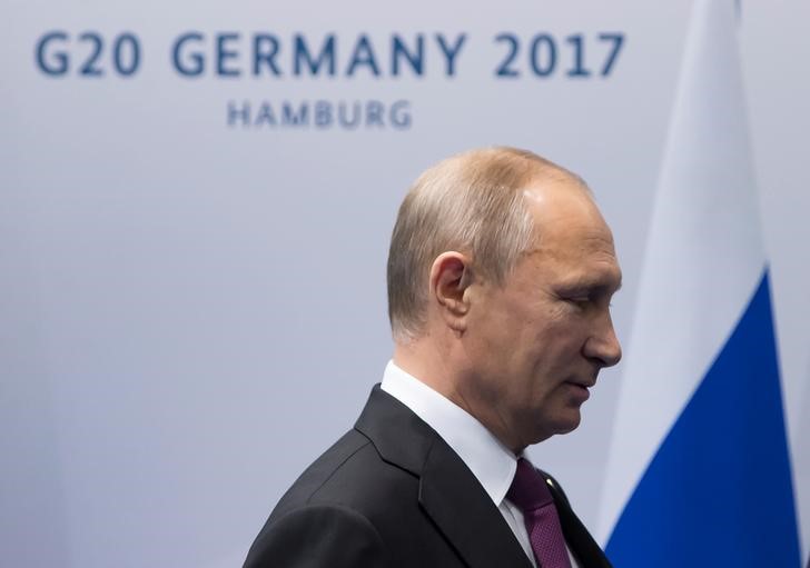 © Reuters. بوتين لقادة مجموعة العشرين: لم نتدخل في الانتخابات الأمريكية