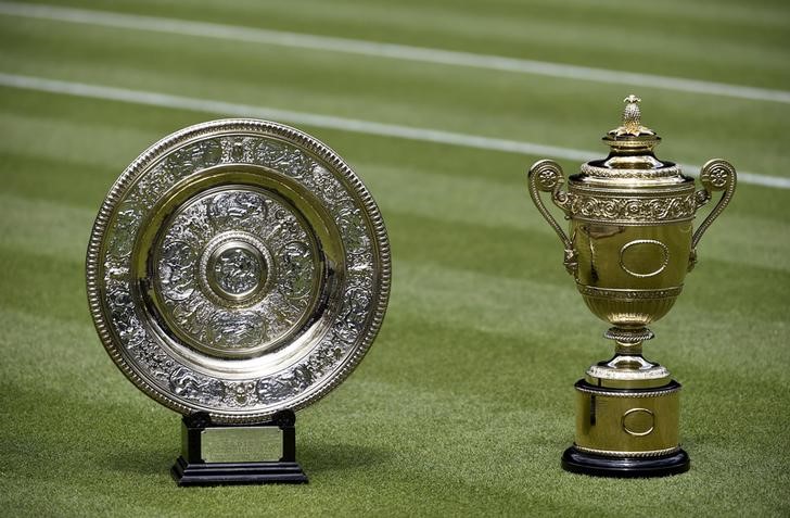 © Reuters. The Men's Singles trophy and Ladies' Singles trophy are seen on Centre Court at Wimbledon in London