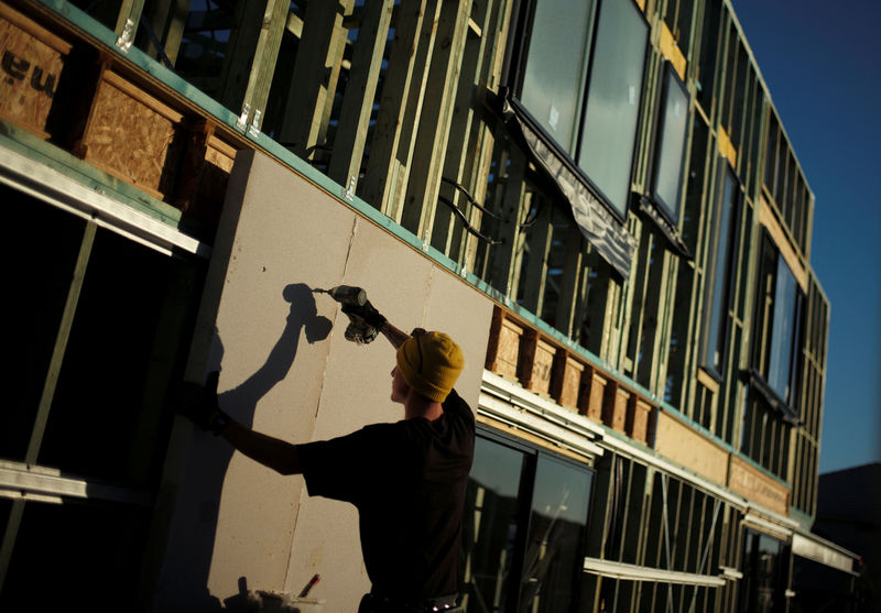 © Reuters. FILE PHOTO: Concrete wall is drilled into the side of the frame of new house being built in Sydney