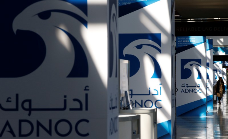 © Reuters. Logos of ADNOC are seen at Gastech, the world's biggest expo for the gas industry, in Chiba