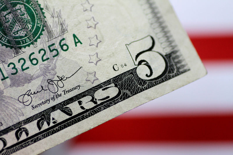 © Reuters. FILE PHOTO: Illustration photo of a U.S. five dollar note