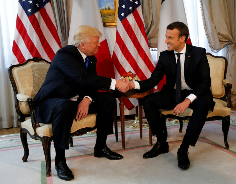 © Reuters. FILE PHOTO: U.S. President Trump and French President Macron shake hands before a lunch ahead of a NATO Summit in Brussels