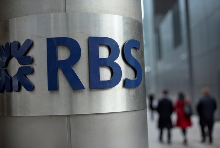 © Reuters. People walk past a Royal Bank of Scotland office in London