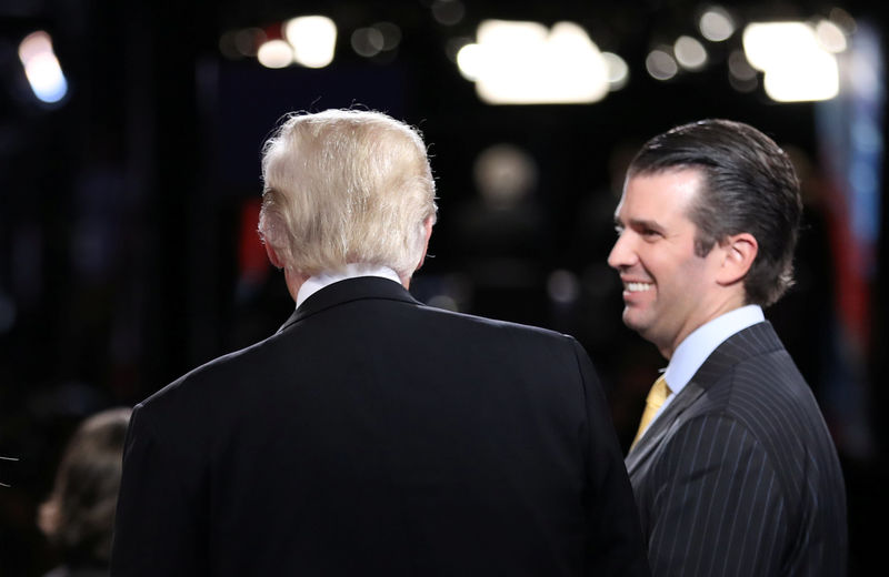 © Reuters. FILE PHOTO: Republican presidential nominee Donald Trump talks with Donald Trump Jr after presidential debate in Hempstead, New York