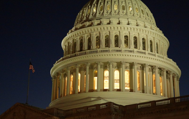 © Reuters. The U.S. Capitol Building is lit at sunset in Washington