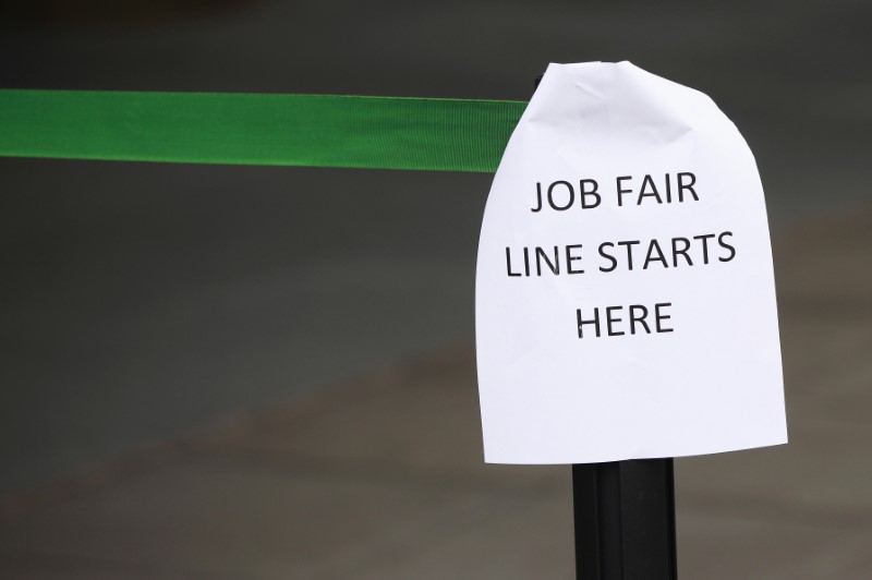 © Reuters. A sign marks the entrance to a job fair in New York