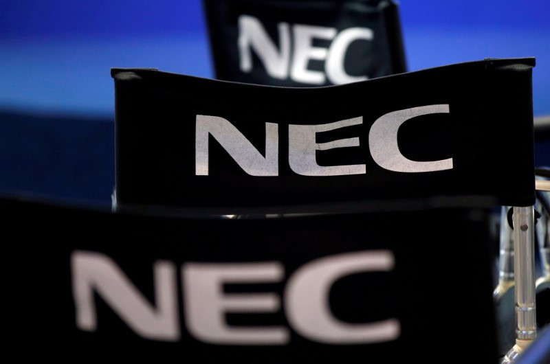 © Reuters. FILE PHOTO: Logos of NEC Corp are pictured at CEATEC JAPAN 2016 in Chiba