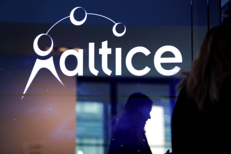 © Reuters. FILE PHOTO: The logo of cable and mobile telecoms company Altice Group is seen during a news conference in Paris