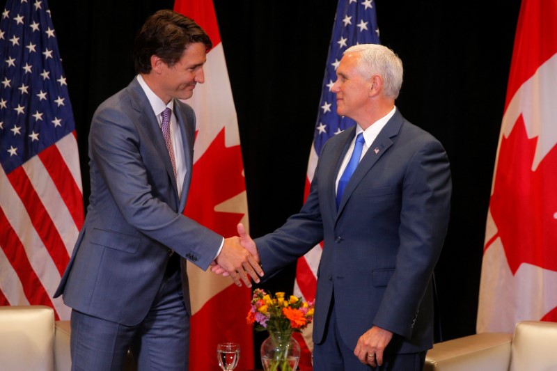 © Reuters. Canadian Prime Minister Trudeau and United States Vice President Pence meet on the sidelines of the National Governors Association summer meeting in Providence