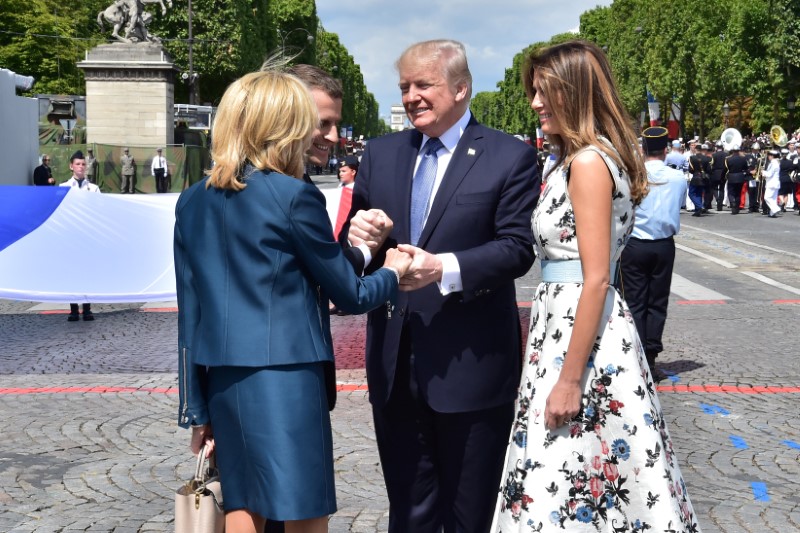 © Reuters. French President Macron and his wife Brigitte Macron, US President Donald Trump and US First Lady Melania Trump attend the traditional Bastille Day military parade