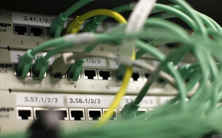 © Reuters. Ethernet cables used for internet connections are pictured in a Berlin office