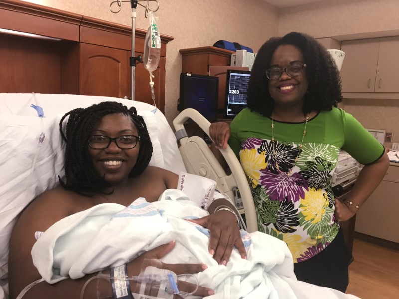 © Reuters. Dr. Nicole Arthur visits Tariyana Wiggins shortly after the birth of Troy O’Brien Williams in the hospital room at the North Baldwin Infirmary in Bay Minette