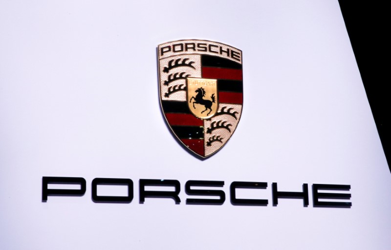 © Reuters. FILE PHOTO: A Porsche logo is pictured on the stand during the 87th International Motor Show at Palexpo in Geneva