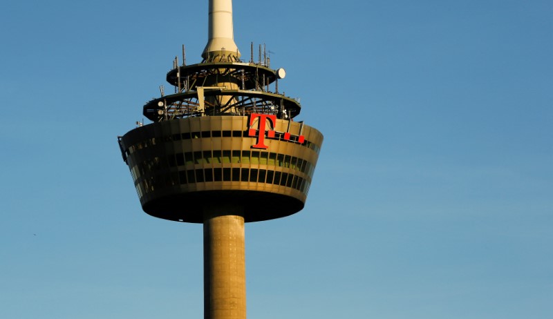 © Reuters. FILE PHOTO: The logo of Germany's telecommunications giant Deutsche Telekom AG is pictured on the 266 metre high "Colonia" TV tower in Cologne