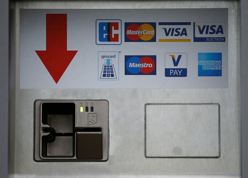 © Reuters. FILE PHOTO: A card slot for various credit and payment cards is pictured in Duesseldorf,