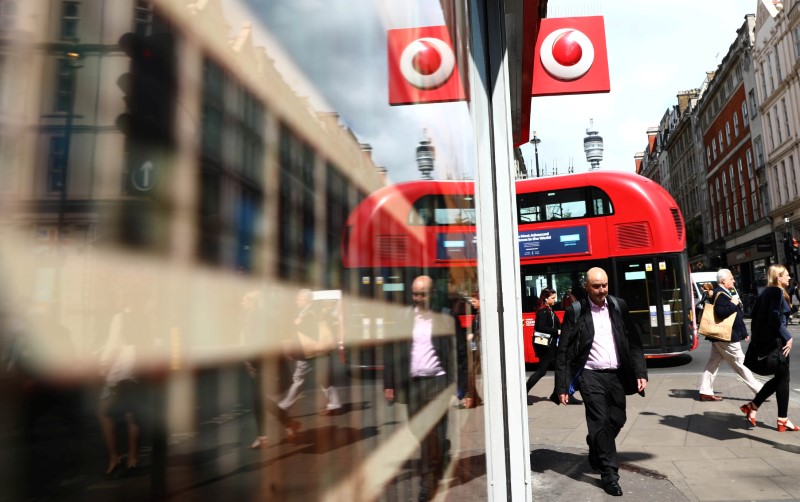 © Reuters. A branded sign is displayed on a Vodaphone store in London