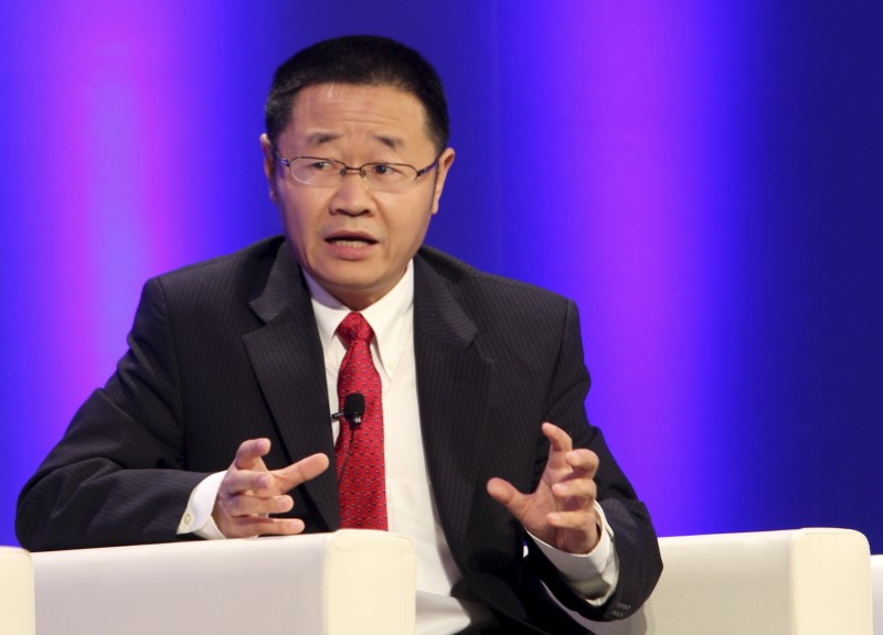 © Reuters. Zhang, then President of Shanghai Stock Exchange, speaks at a conference in Shanghai