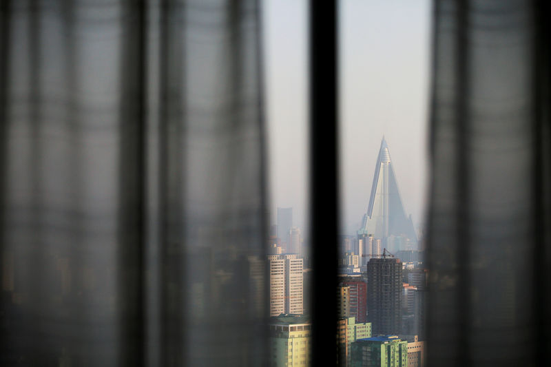 © Reuters. FILE PHOTO: The 105-storey Ryugyong Hotel, the highest building under construction in North Korea, is seen from inside another hotel's room in Pyongyang