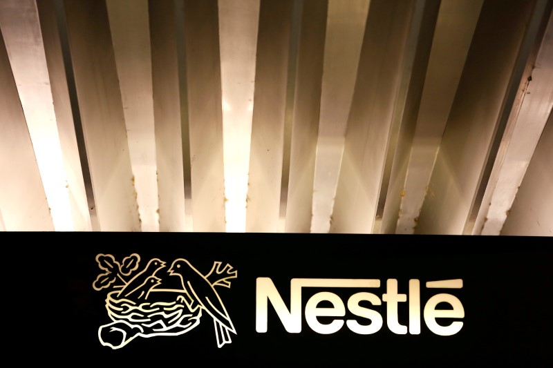 © Reuters. FILE PHOTO: The Nestle logo is pictured on the company headquarters entrance building in Vevey