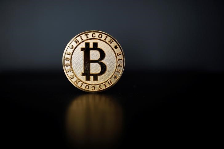 © Reuters. A Bitcoin (virtual currency) coin is seen in an illustration picture taken at La Maison du Bitcoin in Paris