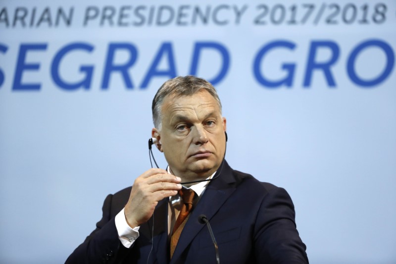 © Reuters. Hungary’s Prime Minister Orban listens during a news conference in Budapest