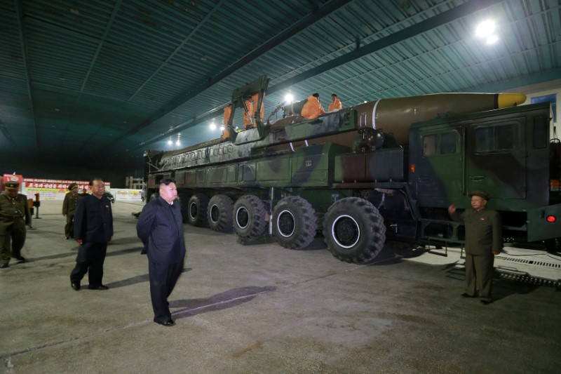 © Reuters. North Korean leader Kim Jong Un inspects the intercontinental ballistic missile Hwasong-14 in this undated photo released by KCNA