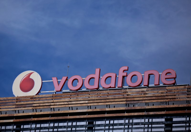 © Reuters. FILE PHOTO: The Vodafone logo can be seen on top of a building outside Madrid, Spain