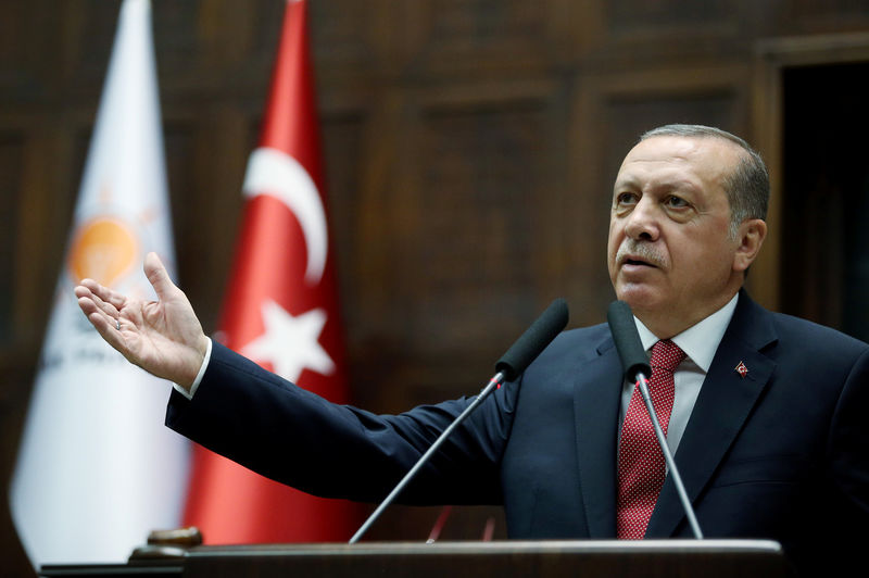 © Reuters. Turkish President Erdogan addresses members of parliament from his ruling AK Party during a meeting at the parliament in Ankara