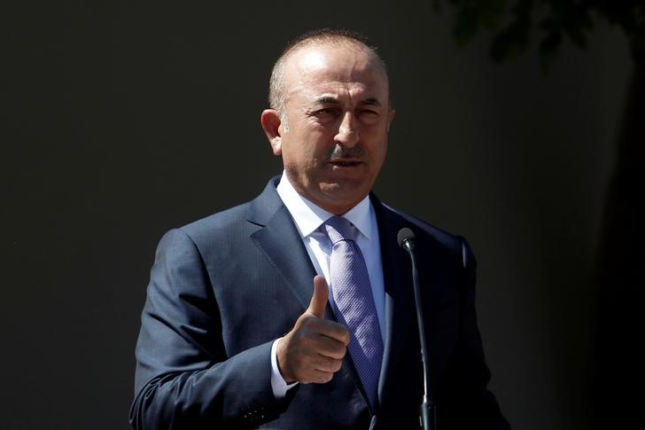 © Reuters. Turkey's Foreign Minister Mevlut Cavusoglu speaks to the media during a visit in the Turkish Cypriot northern part of the divided city of Nicosia