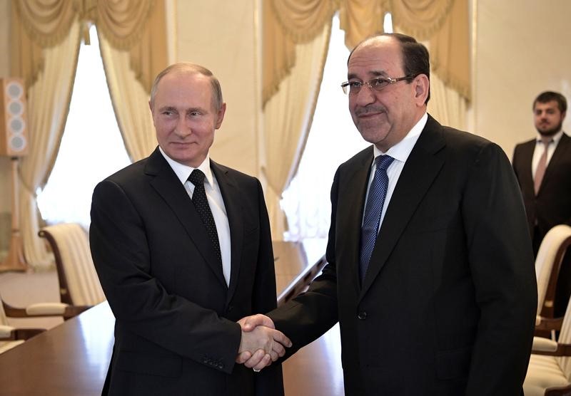© Reuters. بوتين ونائب الرئيس العراقي يبحثان تزويد العراق بدبابات روسية