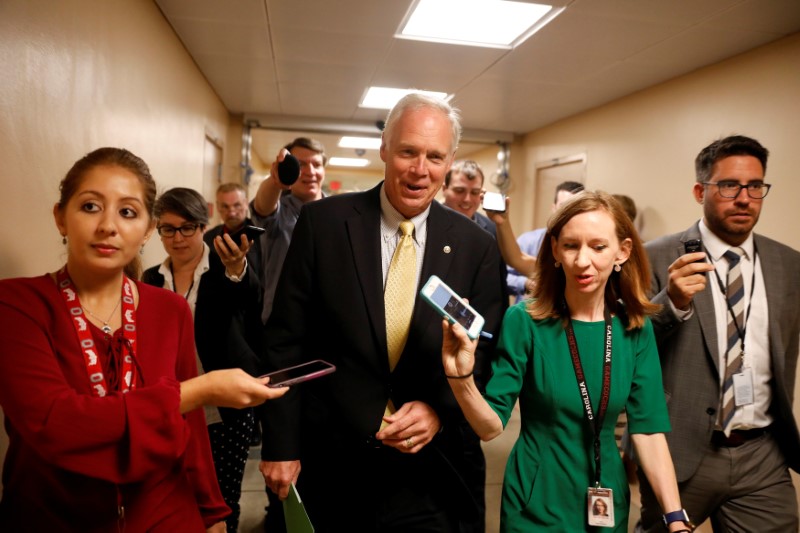 © Reuters. Senator Ron Johnson (R-WI) speaks with reporters ahead of today's vote on the health care bill on Capitol Hill in Washington
