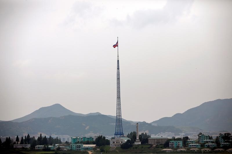 © Reuters. A North Korean flag flutters on top of a tower at the propaganda village of Gijungdong in North Korea, in this picture taken near the truce village of Panmunjom