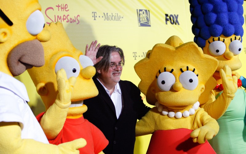 © Reuters. Groening, creator of The Simpsons, poses with characters from the show in Santa Monica