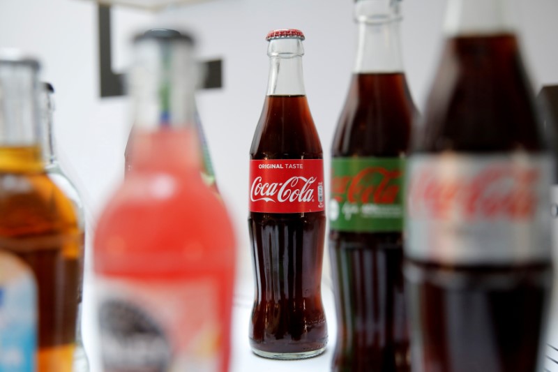 © Reuters. FILE PHOTO: Bottles of Coca-Cola are pictured during a news conference in Paris