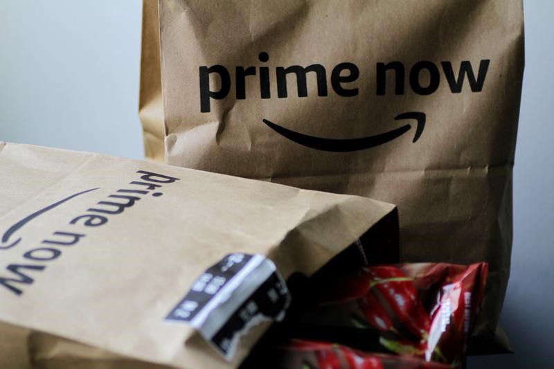 © Reuters. Illustration photo of Amazon Prime Now delivery bags