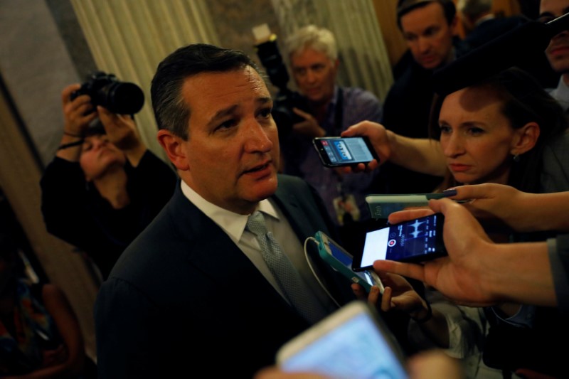 © Reuters. Senator Ted Cruz (R-TX) speaks with reporters after the failure of the "skinny repeal" health care bill on Capitol Hill in Washington