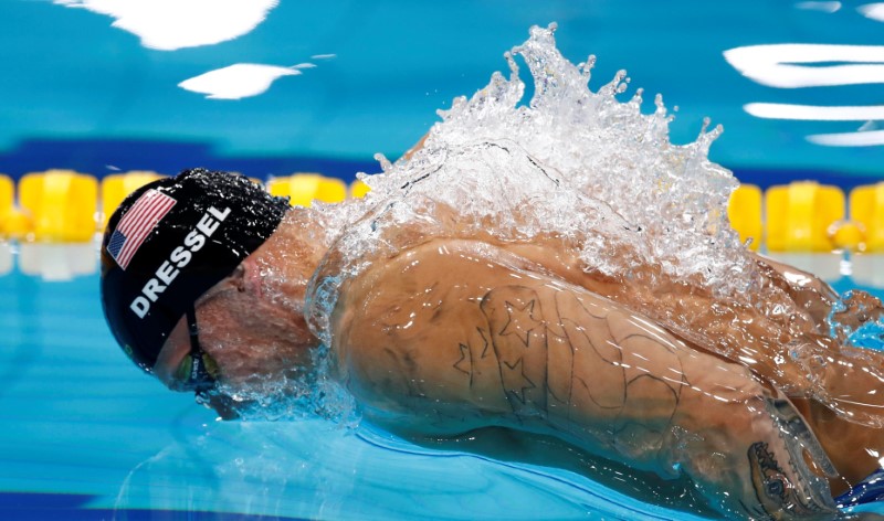 © Reuters. الأمريكي دريسل يجمع ثلاث ذهبيات في أمسية واحدة ببطولة العالم للسباحة