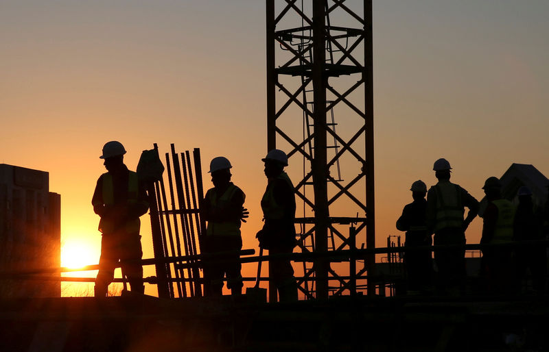 © Reuters. FILE PHOTO: Workers are seen at a construction site in Sandton outside Johannesburg