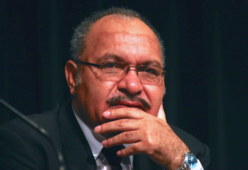 © Reuters. FILE PHOTO - Peter O'Neill, the Prime Minister of Papua New Guinea, speaks during the opening of the PNG Mining and Petroleum Investment conference in Sydney, Australia