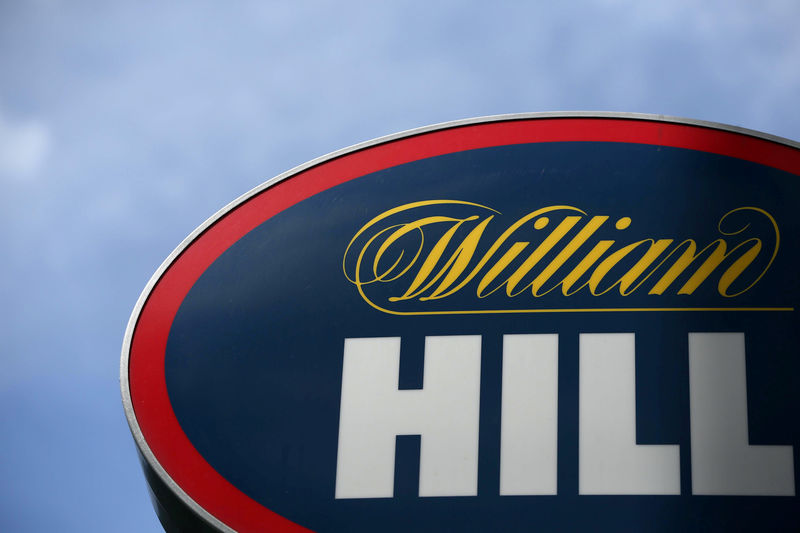 © Reuters. FILE PHOTO: A branded sign is displayed outside a William Hill betting shop in London