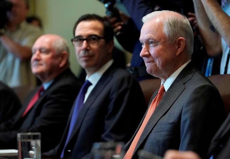 © Reuters. U.S. Attorney General Jeff Sessions smiles as U.S. President Donald Trump speaks during a cabinet meeting at the White House in Washington