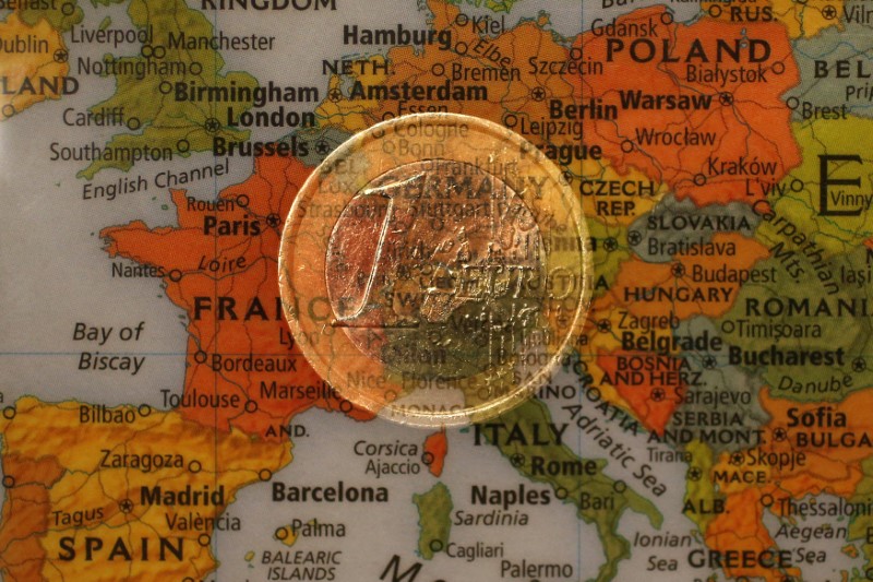 © Reuters. A picture illustration taken with the multiple exposure function of the camera shows a one Euro coin and a map of Europe
