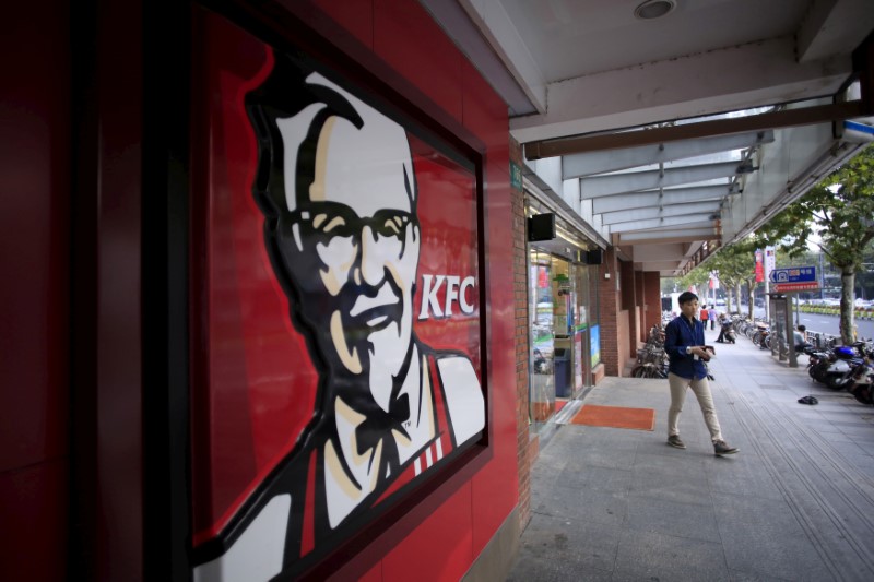 © Reuters. FILE PHOTO: A customer walks out of a KFC restaurant in Shanghai
