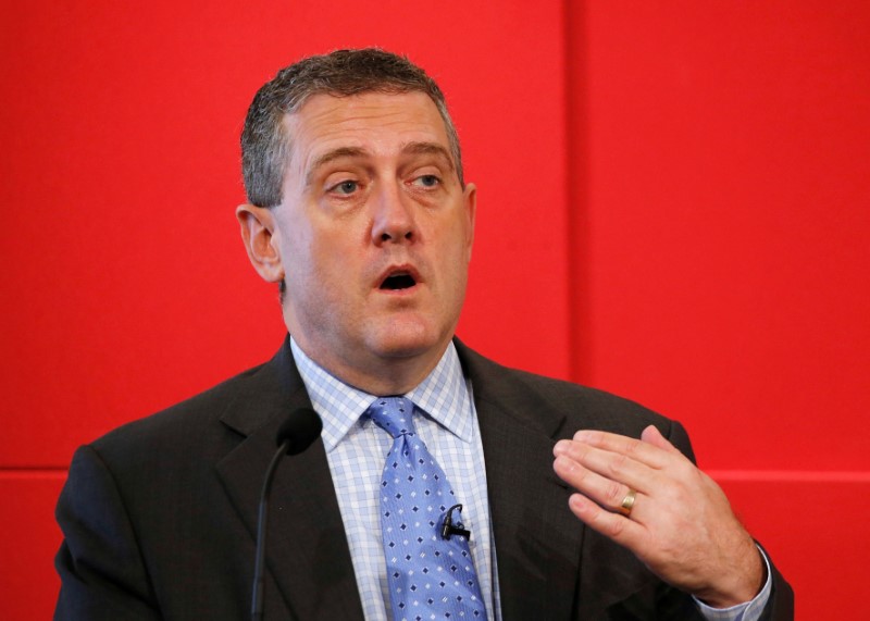 © Reuters. FILE PHOTO: St. Louis Fed President James Bullard speaks at a public lecture on "Slow Normalization or No Normalization" in Singapore