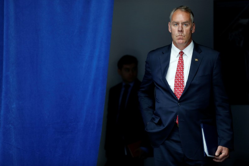 © Reuters. Zinke waits to take the stage with Trump for his on infrastructure improvements, at the Department of Transportation in Washington