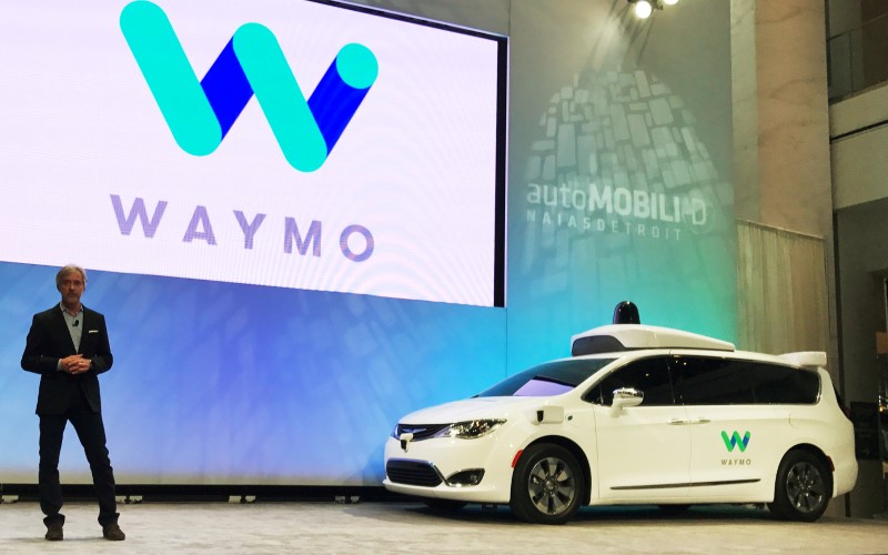 © Reuters. FILE PHOTO: Waymo CEO John Krafcik unveils a Chrysler Pacifica Minivan equipped with a self-driving system developed by the Alphabet Inc unit at the North American International Auto Show in Detroit