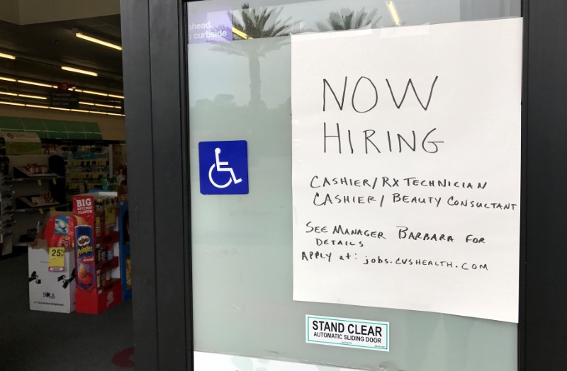 © Reuters. A handwritten hiring sign is posted outside a local drugstore in Solana Beach, California