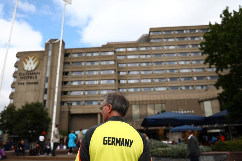 © Reuters. A member of Germany's athletics squad stands by the Tower Hotel in London