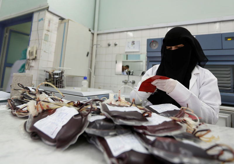 © Reuters. Employee registers bags of blood at a blood transfusion centre in Sanaa, Yemen