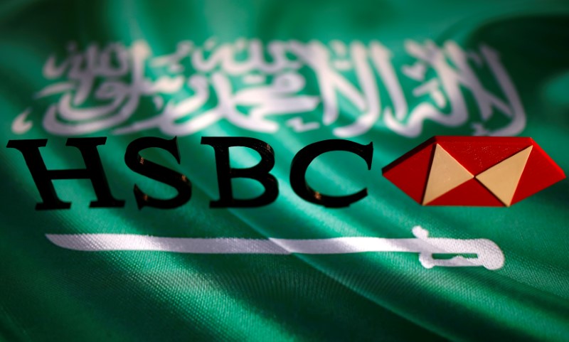 © Reuters. A 3D printed HSBC logo is seen in front of a displayed Saudi Arabia flag in this illustration